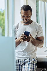 Image showing Bathroom, phone and black man in home on social media, texting or internet browsing. Cellphone, relax or happy male holding mobile smartphone for web scrolling, networking or messaging alone in house