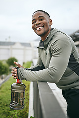 Image showing Fitness, happy or black man with smile or pride after body training, exercise or workout with a water bottle in Miami. Portrait, relaxing or healthy sports athlete with wellness goals or motivation