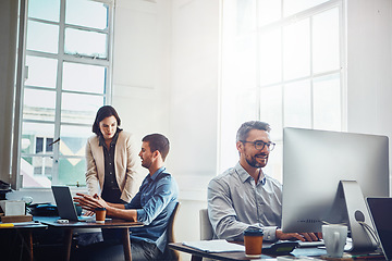 Image showing Office building, computer and business people at desk working on research project, planning and email. Corporate workplace, teamwork and employees sitting at table, in meeting and coworking on ideas