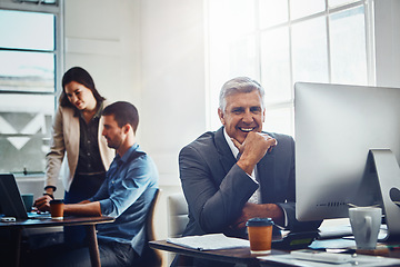 Image showing Portrait, senior and business man by computer in office workplace. Pc, coworking and happy elderly male employee working on marketing report, advertising or sales project with colleagues in company.