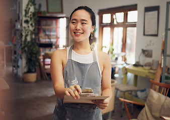 Image showing Asian woman, clipboard and creative business owner with smile for art, design or startup in the workshop. Happy Japanese woman smiling for management, inspection or checklist for arts and crafts