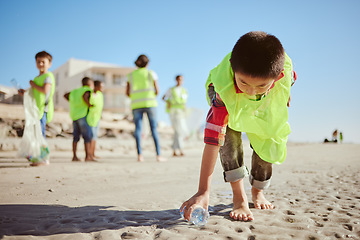 Image showing Environment, cleaning and children with plastic on beach for clean up dirt, pollution and eco friendly volunteer. Sustainability, recycle and kids reduce waste, pick up trash and bottle on beach sand