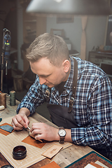 Image showing Concept of handmade craft production of leather goods.