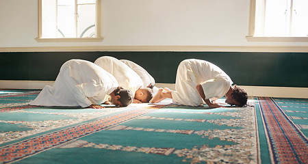 Image showing Muslim, prayer and mosque with a spiritual man group praying together during fajr, dhuhr or asr, otherwise maghrib or ishaa. Salah, worship and pray with islamic friends observing ramadan tradition