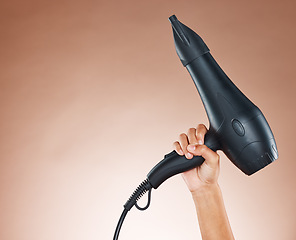 Image showing Hand, hair dryer and salon mockup of appliance, tool or equipment for haircare against a studio background. Hands holding electrical blow dryer for marketing or advertising hair products or cosmetics