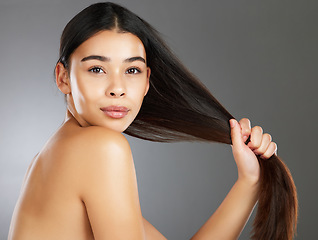 Image showing Woman, hair care and beauty in studio portrait for strong, healthy natural shine and wellness by background. Model, hair glow and cosmetic beauty for health, aesthetic and confidence by backdrop