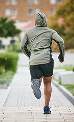 Image showing Fitness, back and black man running in city in winter for health, wellness and strength. Sports, exercise and male runner training, cardio jog or exercising outdoors alone on street for marathon.