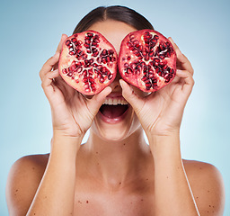 Image showing Pomegranate, beauty and woman hands with natural skincare product, detox and healthy skin with vegan and organic treatment. Happy, fruit and wellness with health for body against studio background.