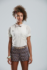 Image showing Fashion, style and clothes with a model black woman in studio on a gray background to promote a clothing brand. Summer, shorts and afro with an attractive young female on space for branding