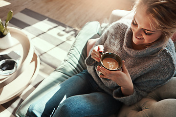 Image showing Woman, coffee and relax smile on sofa in living room for calm, peace and happy quality time. Female, drinking warm tea and happiness or lifestyle wellness, morning routine and rest on couch in home