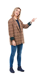 Image showing Fashion portrait, woman and pointing to mockup in studio isolated on a white background. Product placement, marketing promotion and happy young female show mock up for advertising space or branding.