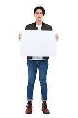 Image showing Sign, portrait and man with poster for mockup, marketing or advertising space in studio isolated on a white background. Product placement, branding and young male with banner for mock up or promotion