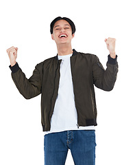 Image showing Portrait, winner and success celebration of man in studio isolated on white background. Winning, achievement and happy, young and excited male fist pump celebrating goals, targets or lottery victory.