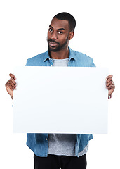 Image showing Sign, portrait and black man with poster for mockup, marketing or advertising space in studio isolated on a white background. Product placement, branding and male with banner for mock up or promotion