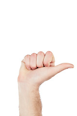 Image showing Hand, communication and man thumb pointing in a studio for sign language, direction or counting. Finger, body language and man with a hand gesture isolated by a white background with mockup space.