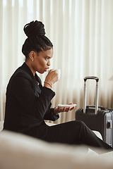 Image showing Coffee, travel and luggage with a business black woman drinking a beverage in an airport departure lounge. Tea, corporate and business class with a female employee waiting in a terminal with baggage