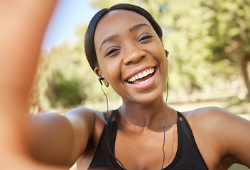 Image showing Fitness, selfie and black woman in park for workout, exercise and healthy lifestyle with music. Portrait, smile and female athlete taking photograph for social media, sports wellness and video call