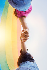 Image showing LGBTQ community, rainbow flag and couple holding hands for human rights protest, solidarity and gay lesbian support. Queer, sky and black people together in love, partnership and equality below view