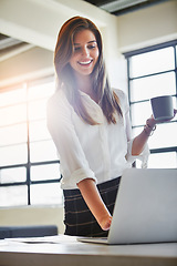 Image showing Coffee, laptop and business woman in office writing email in workplace. Tea, computer and happy female employee holding espresso while typing, working on report or advertising proposal in company.