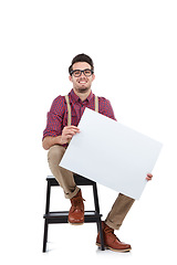 Image showing Man, studio portrait and paper board for marketing, branding mockup and vote by white background. Young model, isolated and sitting with mock up poster, holding billboard and space for advertising