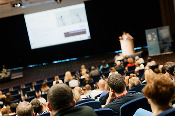 Image showing Speaker giving a talk on scientific conference. Audience at the conference hall. Business and Entrepreneurship concept.