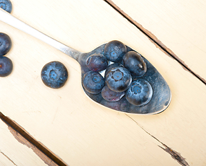 Image showing fresh blueberry on silver spoon