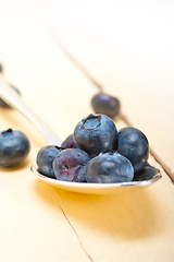 Image showing fresh blueberry on silver spoon