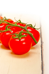 Image showing fresh cherry tomatoes on a cluster