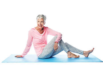 Image showing Yoga, fitness and senior woman in studio isolated on a white background. Zen chakra, pilates and retired, elderly and happy female model sitting on mat, thinking and training for health and wellness.