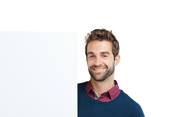 Image showing Portrait, studio and man with a board with mockup space for marketing, advertising or product placement. Happy, smile and male model with a banner, poster or signage isolated by a white background.