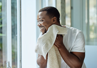 Image showing Black man, skincare and towel after washing face in home bathroom for clean and healthy skin with dermatology. Male happy after a facial, shower or cleaning body with water for hygiene and wellness