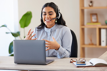 Image showing Video call, laptop and seminar with a business indian woman meeting online while sitting in her office at work. Remote work, headset and communication with a female employee talking in a webinar