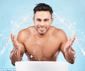 Image showing Cleaning, water splash and portrait of man happy with self care routine, facial hygiene and body hygiene wash. Water drop, bathroom skincare hydration and beauty model with health wellness treatment