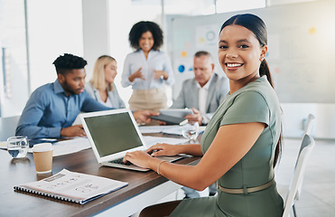 Image showing Meeting, planning and portrait of a woman on a laptop typing a report, project or proposal in office. Technology, professional and female employee working on corporate strategy with team in boardroom