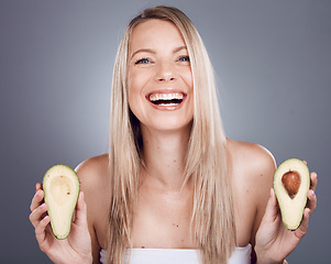 Image showing Portrait, beauty and avocado with a model woman in studio on a gray background for natural treatment. Face, skincare and nutrition with an attractive young female posing to promote skin antioxidants