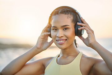 Image showing Fitness, music or happy woman at beach for running training, exercise or workout at sunset in Brazil. Portrait, sports athlete or healthy girl runner listening to podcast or radio audio in headphones