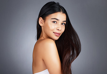 Image showing Woman, hair care and beauty in studio portrait for strong, healthy natural shine and wellness by background. Model, hair glow and cosmetic self care for health, self love and confidence by backdrop