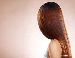 Image showing Salon, hair and back of woman in studio for hair care, hair products and cosmetics on beige background. Beauty, balayage and girl with healthy, shine and long hair for hair salon, treatment and glow