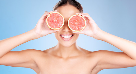 Image showing Grapefruit, skincare and wellness of a woman with fruit, happiness smile or healthcare face glow. Model, happy or girl with fruits for health, cosmetic and healthy aesthetic facial beauty with food