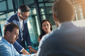 Image showing Business people, meeting and talk for strategy, planning and success with teamwork, vision and leader. Businessman, leadership and group at desk with woman, man and discussion while sitting in office