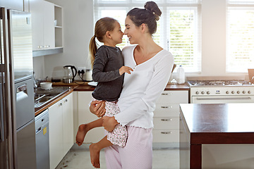 Image showing Home, kitchen and mother hug child for bonding, love or holiday celebration together on mothers day. Happy family, quality time and development support of mom and girl or kid on mothersday in house