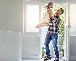 Image showing Happy, freedom and dad carrying a girl in their modern family home for fun, care and love. Smile, happiness and mature man playing and bonding with his excited daughter in their house in Australia.