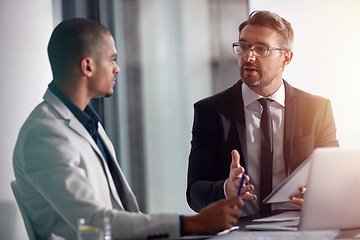 Image showing Business people, talking and tablet for planning online with partner for marketing strategy. Men in management speaking and discussion at table about ideas for corporate collaboration in office