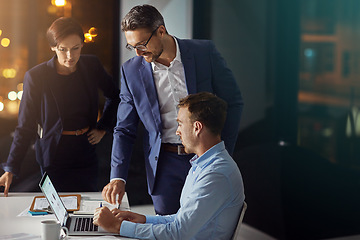 Image showing Business people, laptop and meeting working at night in office for big data collaboration, planning overtime and report deadline. Teamwork, late and digital tech conversation with web design leader