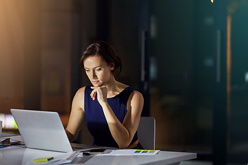 Image showing Woman, laptop and thinking at office in night for planning, vision or analysis of data for mission. Corporate executive, computer and analytics for digital marketing on internet in dark modern office