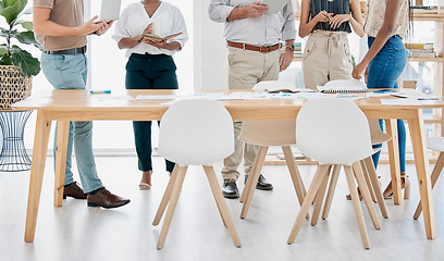 Image showing Meeting, collaboration and table with a business team standing in the boardroom for strategy or planning. Corporate, teamwork and documents with a man and woman employee group in a training workshop