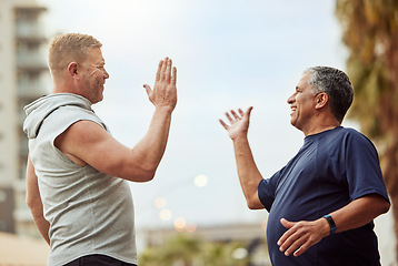 Image showing High five, hand shake and senior friends in the city outdoor for a workout, exercise or running. Teamwork, motivation and success with a mature man and friend in celebration of a training goal