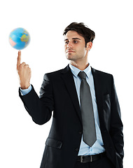 Image showing Global, business and man with earth on finger, sustainability and future in international industry isolated on white background. Balance, work and corporate businessman with planet in hand in studio.