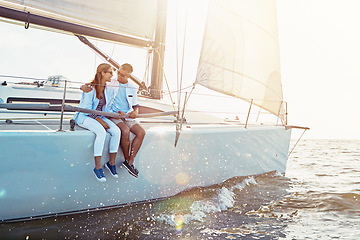 Image showing Happy couple, ship and cruise for hug, ocean or summer sunshine for love, romance or outdoor adventure. Man, yacht and woman with waves, bonding or peace for luxury, lifestyle and travel for holiday