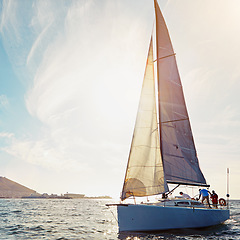 Image showing Ocean, yacht travel and sailing on the sea on vacation by summer sunshine on water. Lens flare, luxury holiday adventure and boat cruise of people in the sun and blue sky in nature with mockup